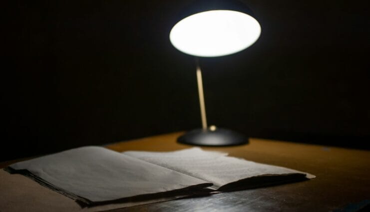 black table lamp beside book